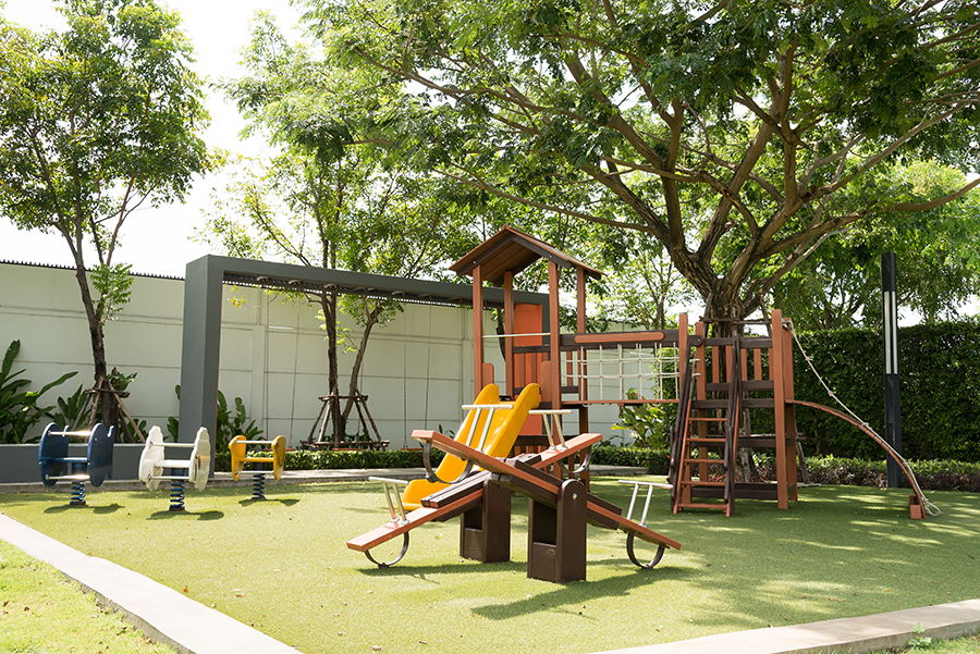 Set of children playground on artificial grass.