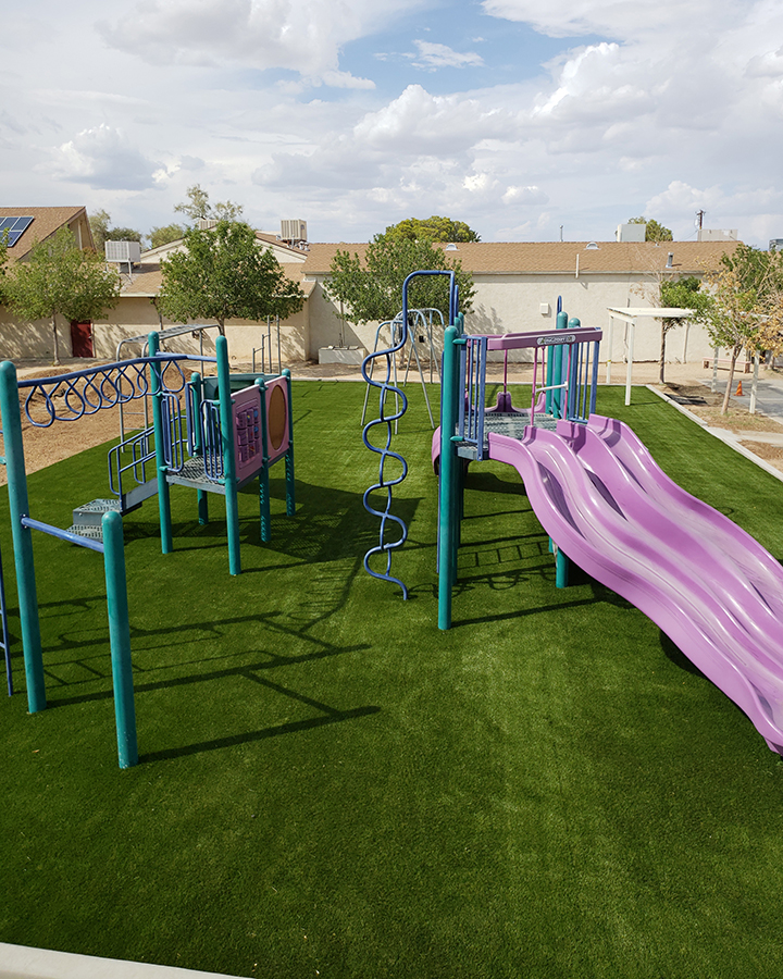 Turf playground with purple slide.