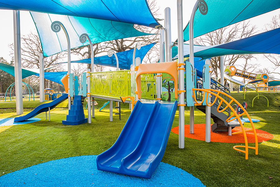 Modern playground with IPEMA certified artificial grass.