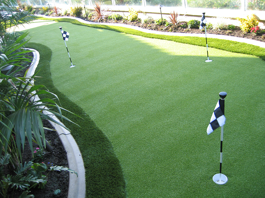 Turf putting green with 3 flags.