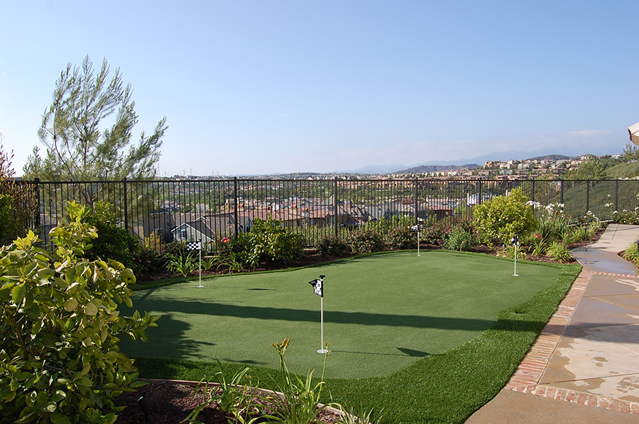 Artificial grass backyard putting green with a view.