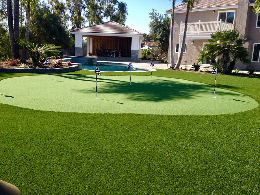 Turf putting green installation with a pool