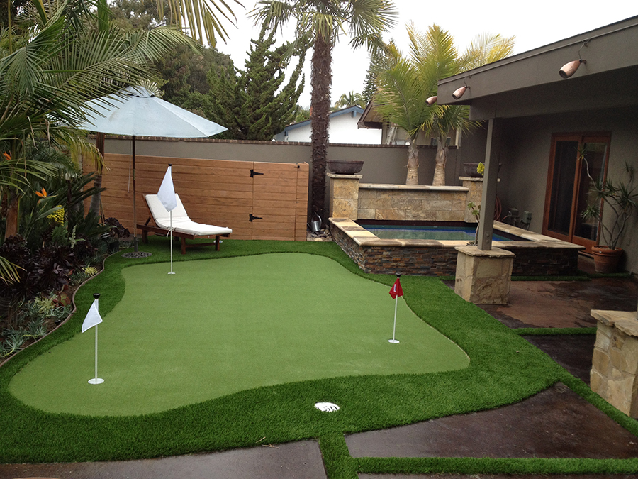 Artificial grass backyard putting green.